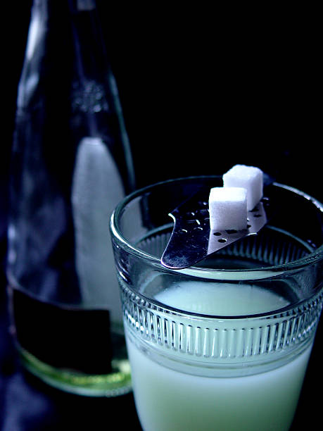 Absinthe A glass of the green fairy with sugar cubes. absinthe spoon stock pictures, royalty-free photos & images