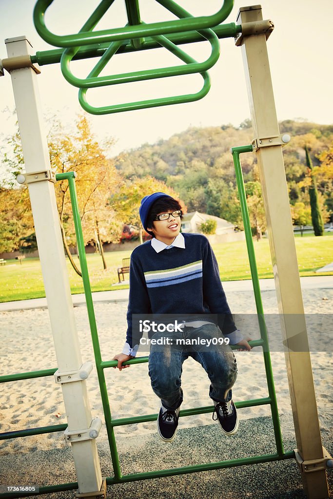 teenager sitting at the playground  14-15 Years Stock Photo