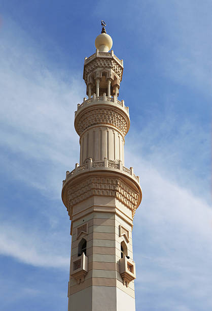 mosque minaret against blue sky..
