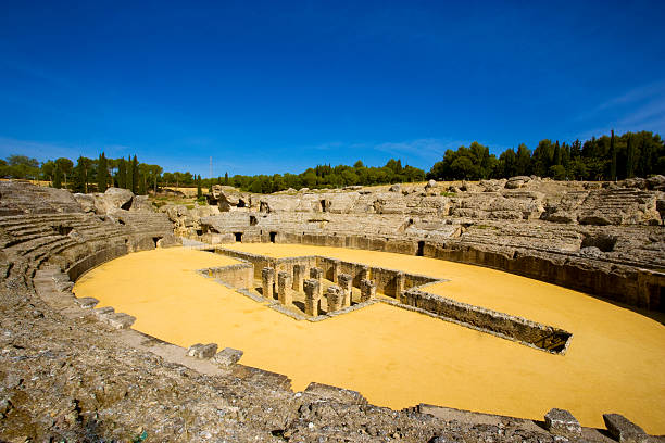 Roman Arena "The ruined roman arena at Italica, Spain." italica spain stock pictures, royalty-free photos & images