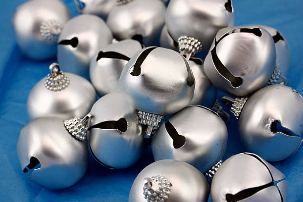 istock Christmas bell ornaments in a pile on blue 173617392