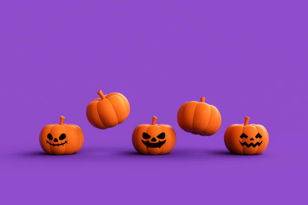 istock Jack-o-Lantern pumpkins on purple background. 1736177103