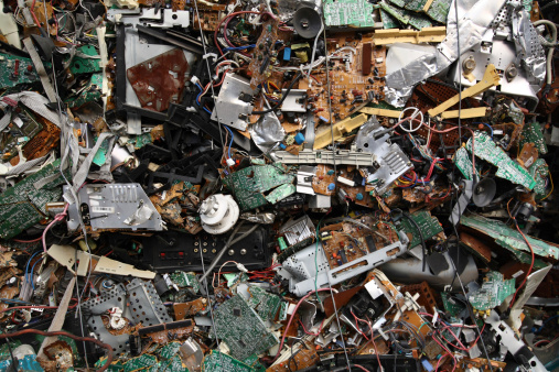 Old electronic and computer scrap. Bound by metal wire into cubes for recycling.