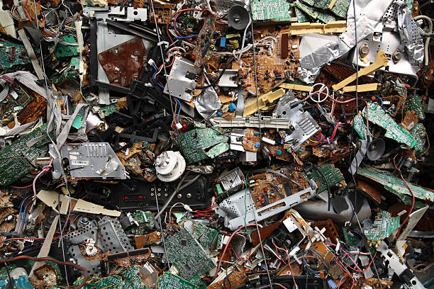 Electronic Scrap Old electronic and computer scrap. Bound by metal wire into cubes for recycling. recycling computer electrical equipment obsolete stock pictures, royalty-free photos & images