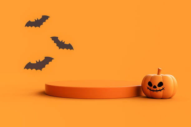 istock Jack-o-Lantern pumpkin with podium for product display and bats on orange background. 1736177691