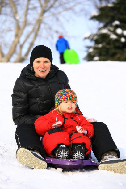 istock Mother and Child Tobogganning 173618146