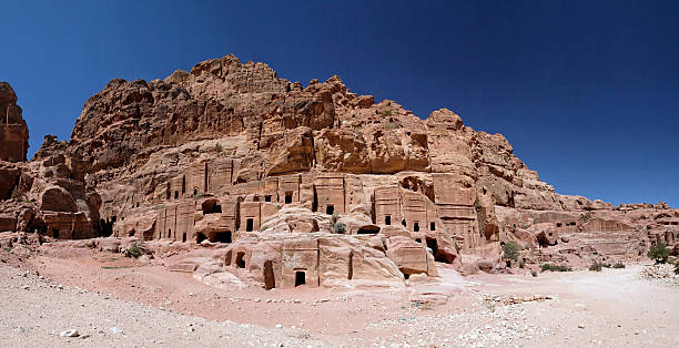 The Obelisk Tomb is situated just prior to the entrance of Al Siq in Petra, Jordan. The tomb is carved from the living sandstone rock.