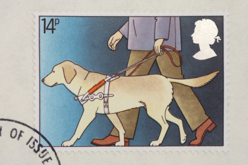 Postage stamp showing a guide dog for the blind