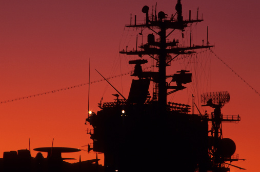 Aircraft carrier at sunset