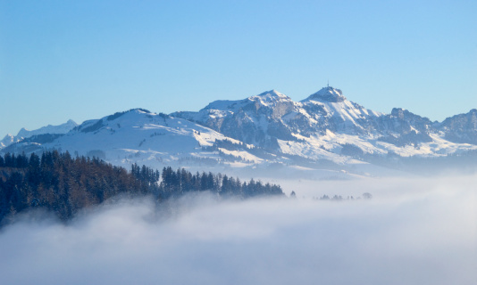 The summit of Hoher Kasten in eastern Switzerland appearing over fog in winter.See all my
