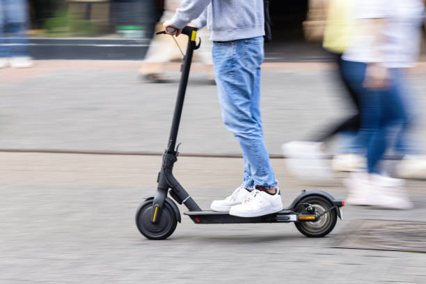 istock young person with a kick scooter in a pedestrian area 1736197705