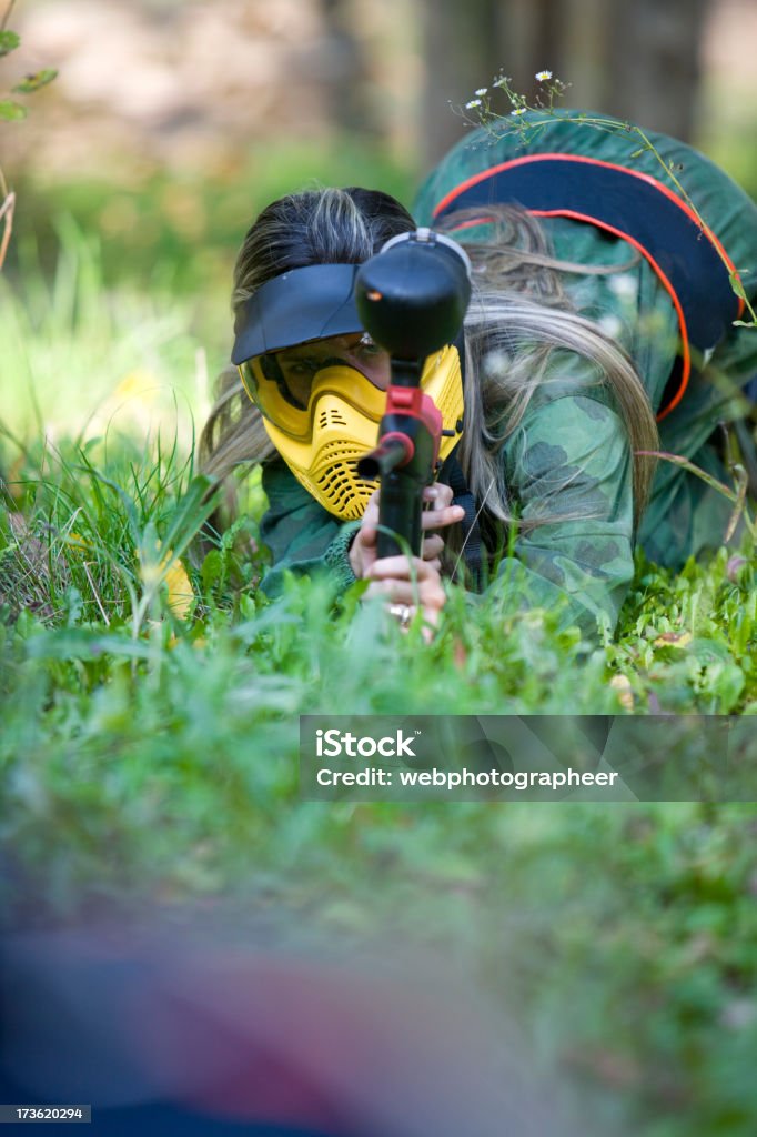 Paintball "Woman playing paintball, selective focus, canon 1Ds mark III" Paintballing Stock Photo