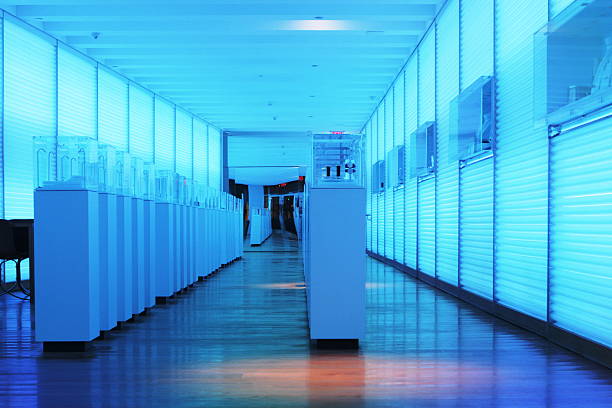 Retail store interior with stunning blue illuminated display cabinets at night after closing hours imparting a surreal feeling.