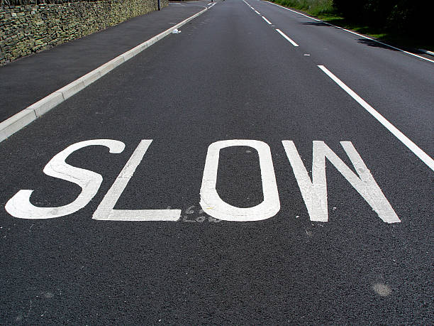 lento road - slow moving vehicle sign foto e immagini stock