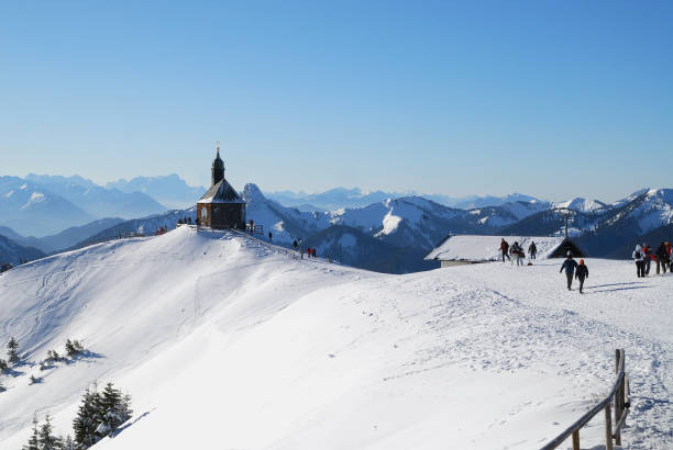 Snow covered mountain range in the Bavarian foothills of the Alps. View in west direction to Garmisch-Partenkirchen and the Mt. Zugspitze.