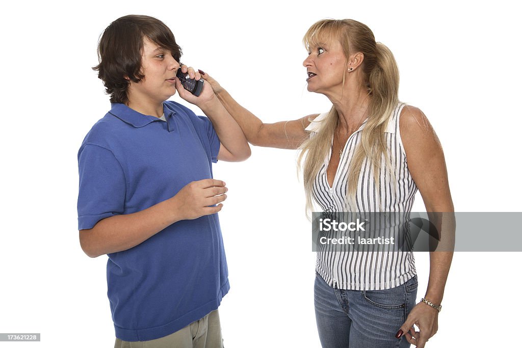 Give it to me. A teen ignoring his mother about cell phone minutes. 14-15 Years Stock Photo