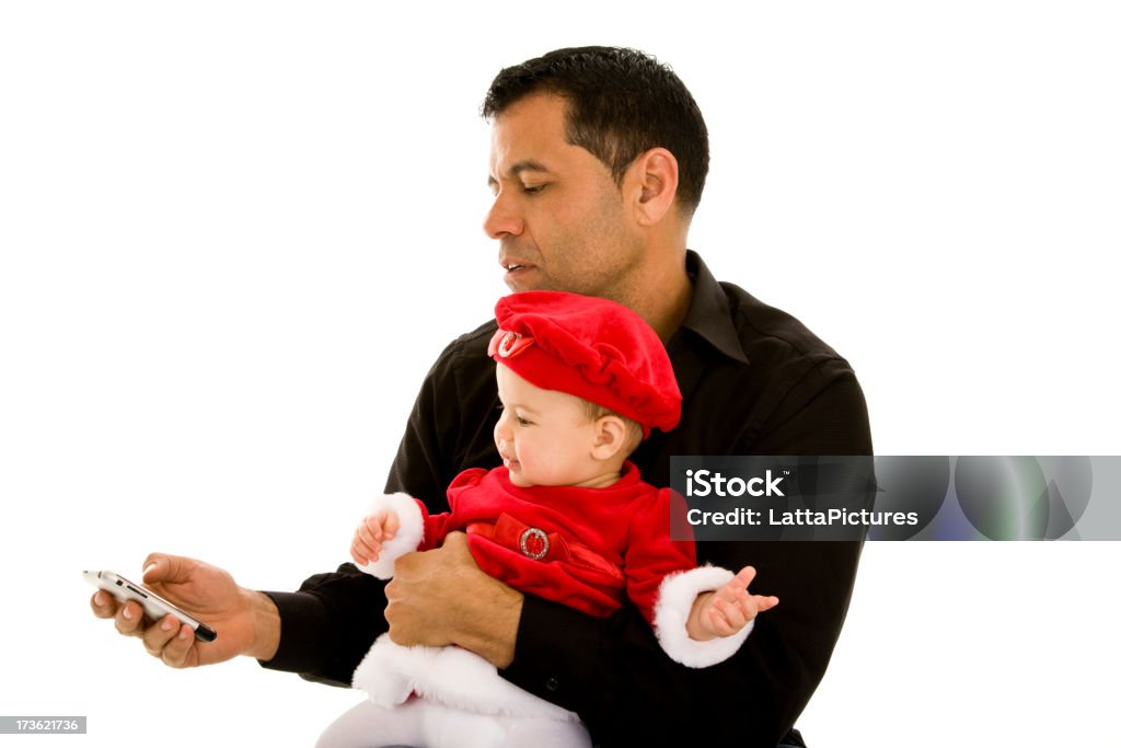 Maschio Ispanico padre con bambino ragazza vestita in costume da Babbo Natale - Foto stock royalty-free di Natale