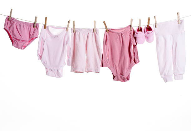 Baby goods hanging on the clothesline stock photo