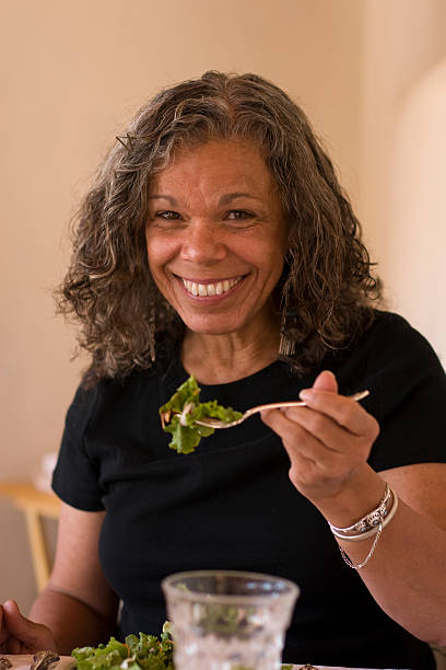 istock Middle-aged Woman Eating Salad 173622829