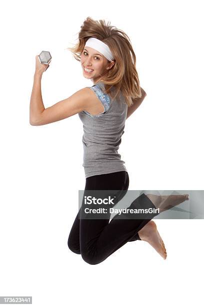 Smiling Exercise Woman Jumping With Weights Isolated White Background Stock Photo - Download Image Now