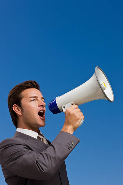 istock Happy businessman holding megaphone 173623568