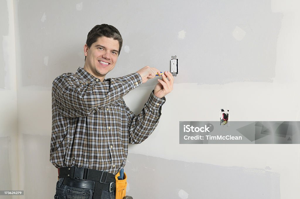 The  Handyman Electrician at workhandyman with a hammerHere's more in my lightbox Adult Stock Photo