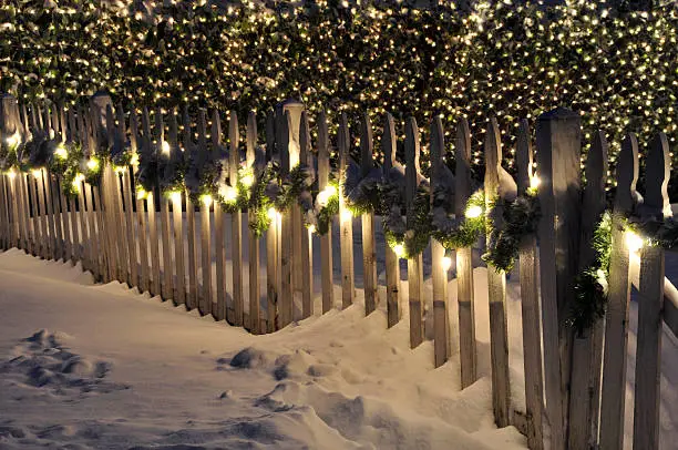 Photo of Snowy Fence at Night