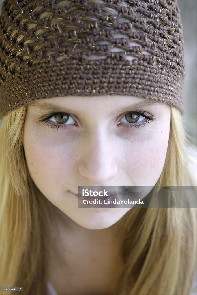 Pretty Teen Portrait Beautiful fourteen year old girl gazing into camera. Shallow DOF. More images with this model. 14-15 Years Stock Photo