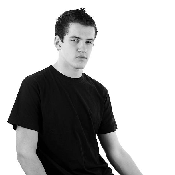young teenager boy posing in urban setting