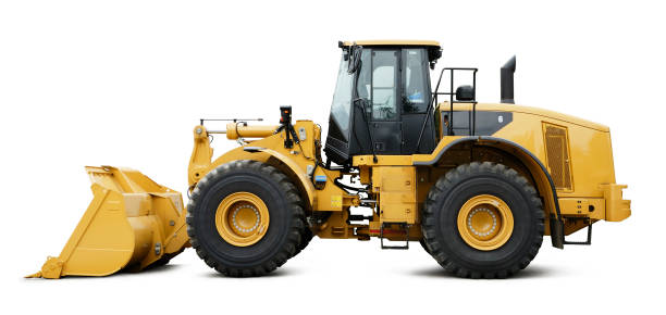 A bull dozer with huge tires on a white background Heavy construction machine in mint condition - isolated on white with shadow + clipping path construction vehicle stock pictures, royalty-free photos & images