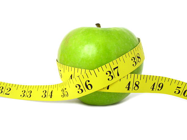 istock Green Apple and Measure Tape 173625872