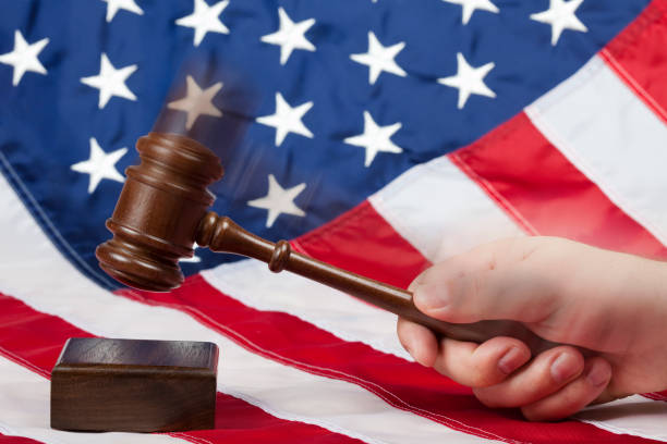 istock Gavel in hand against US flag 173626067