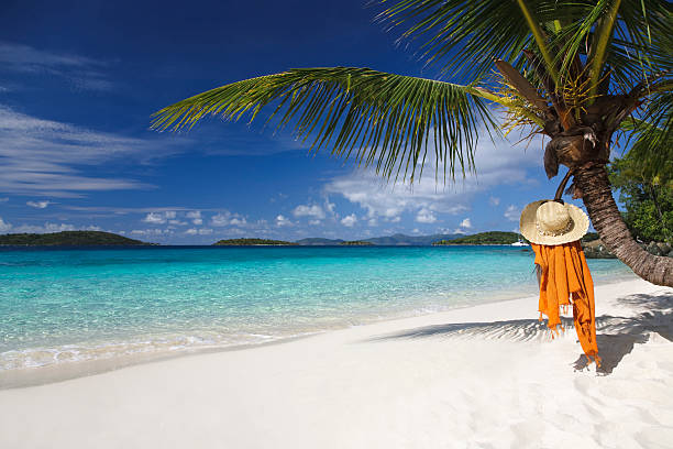 istock hat and sarong on the Caribbean beach 173627154