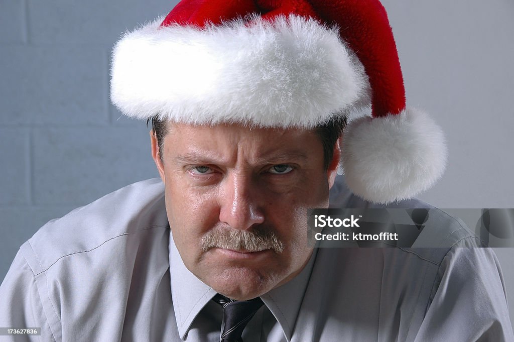 Mister Grinch Mid Level manager wearing a santa hat and a bah humbug expression. Click photo below to see other pictures of this model. Human Face Stock Photo