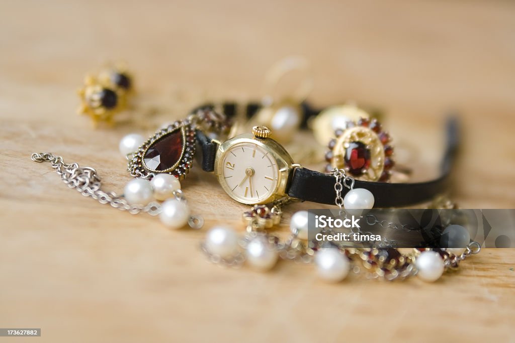 Old watch and jewelry Old and retro-styled jewelry around a gold watch.Similar: Antique Stock Photo