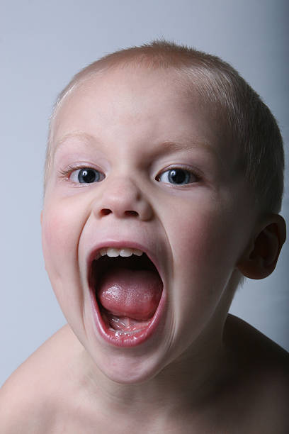 child yelling stock photo