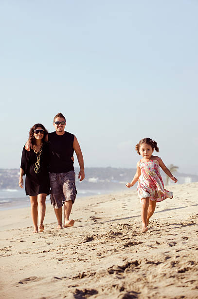 istock Young family at the beach 173629380