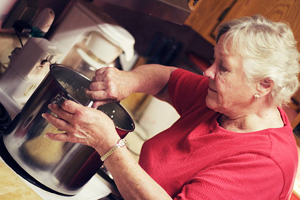 istock Senior Woman Cooking 173629500