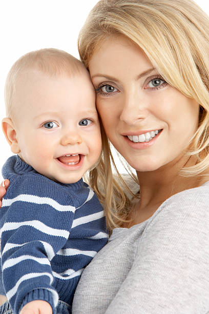 Mother Cuddling Young Son stock photo