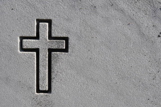 istock Cross carved on a headstone 173630381