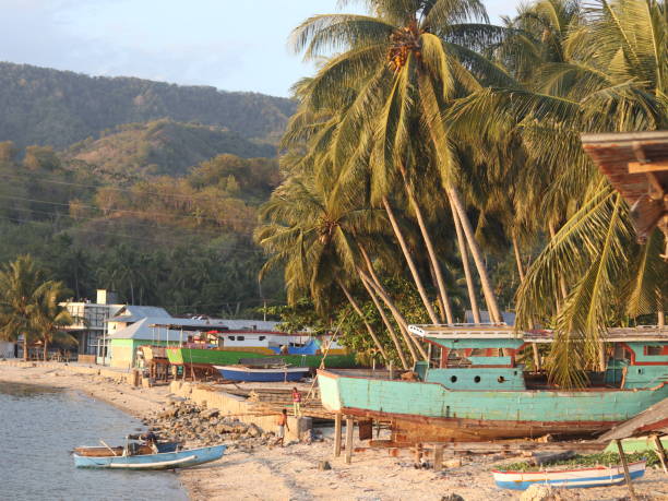 istock fishing boat leaning on the beach 1736305590