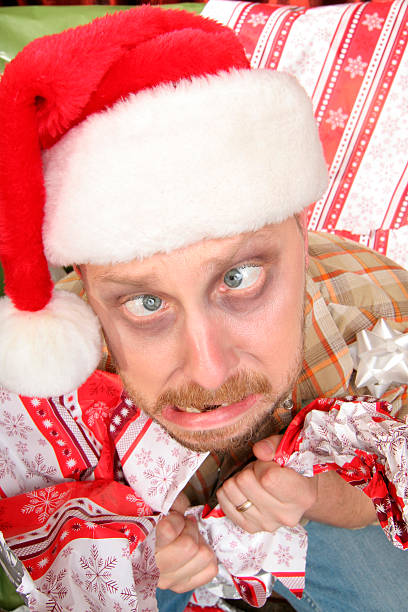 istock Frazzled man in wrapping frenzy 173632772