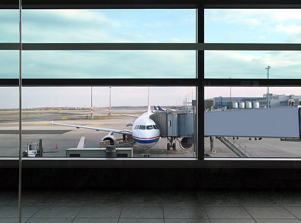 View of airplane and boarding gate from window of departure lounge.Click on the photo below to view more images from my flight collection.