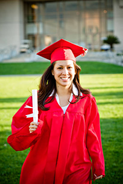 istock female graduate walking with diploma 173633368