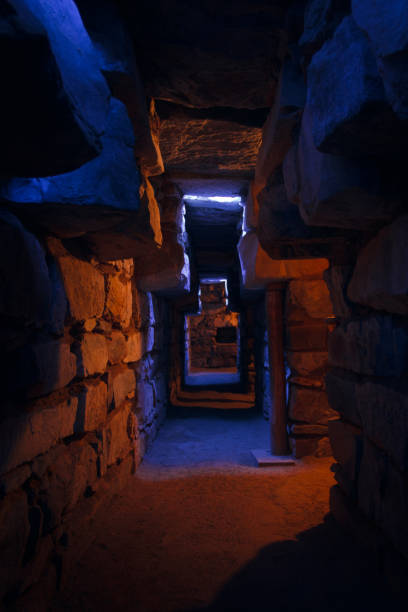 Lights and Shadows in Chavin: Gallery of the Offerings with artificial light inside the temple. Unesco stock photo