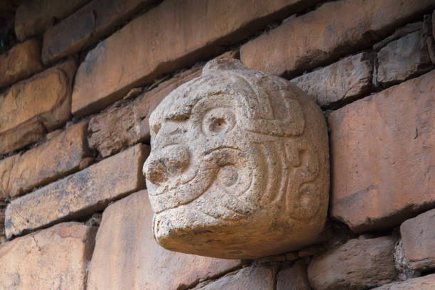 Eternal Watcher: the Last Nailed Head of the Temple of Chavin looks at us from a remote past. Unesco stock photo