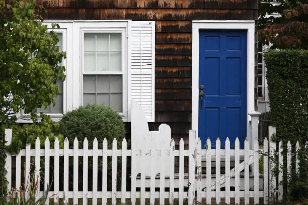 istock Traditional house with white picket fence 173633852