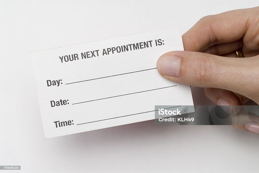 Appointment Card Hand holding a blank appointment card Blank Stock Photo
