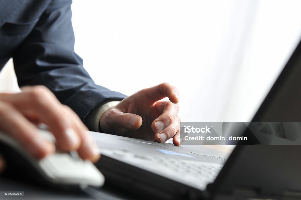 Close-up on busy Businessman's hands and notebook "Man working on notebook, office interior, window on background. Nikon D300, Nikkor 24-70 mm 2.8G ED, Exposure: f/4, 55 mm." Black Color Stock Photo