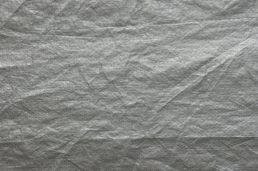 A grey plastic tarp texture.